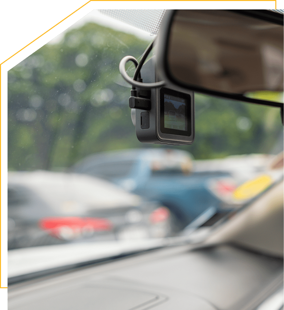 Car dashboard camera recording traffic