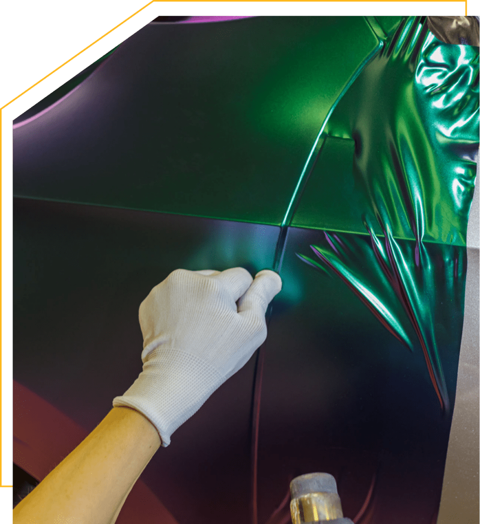 Applying iridescent vinyl wrap on car